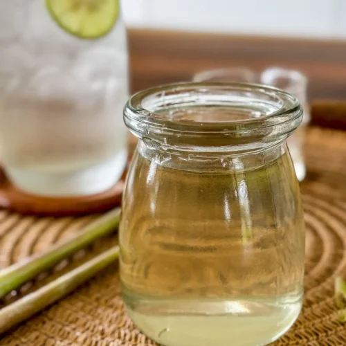 Homemade lemongrass syrup in a glass jar.