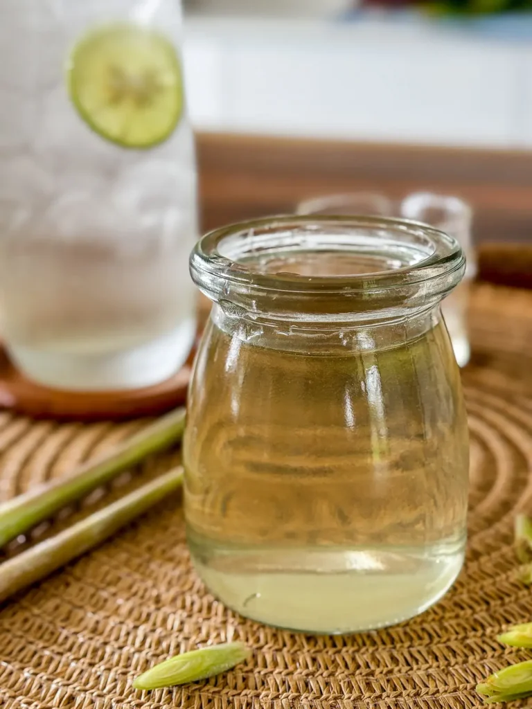 Homemade lemongrass syrup in a glass jar.
