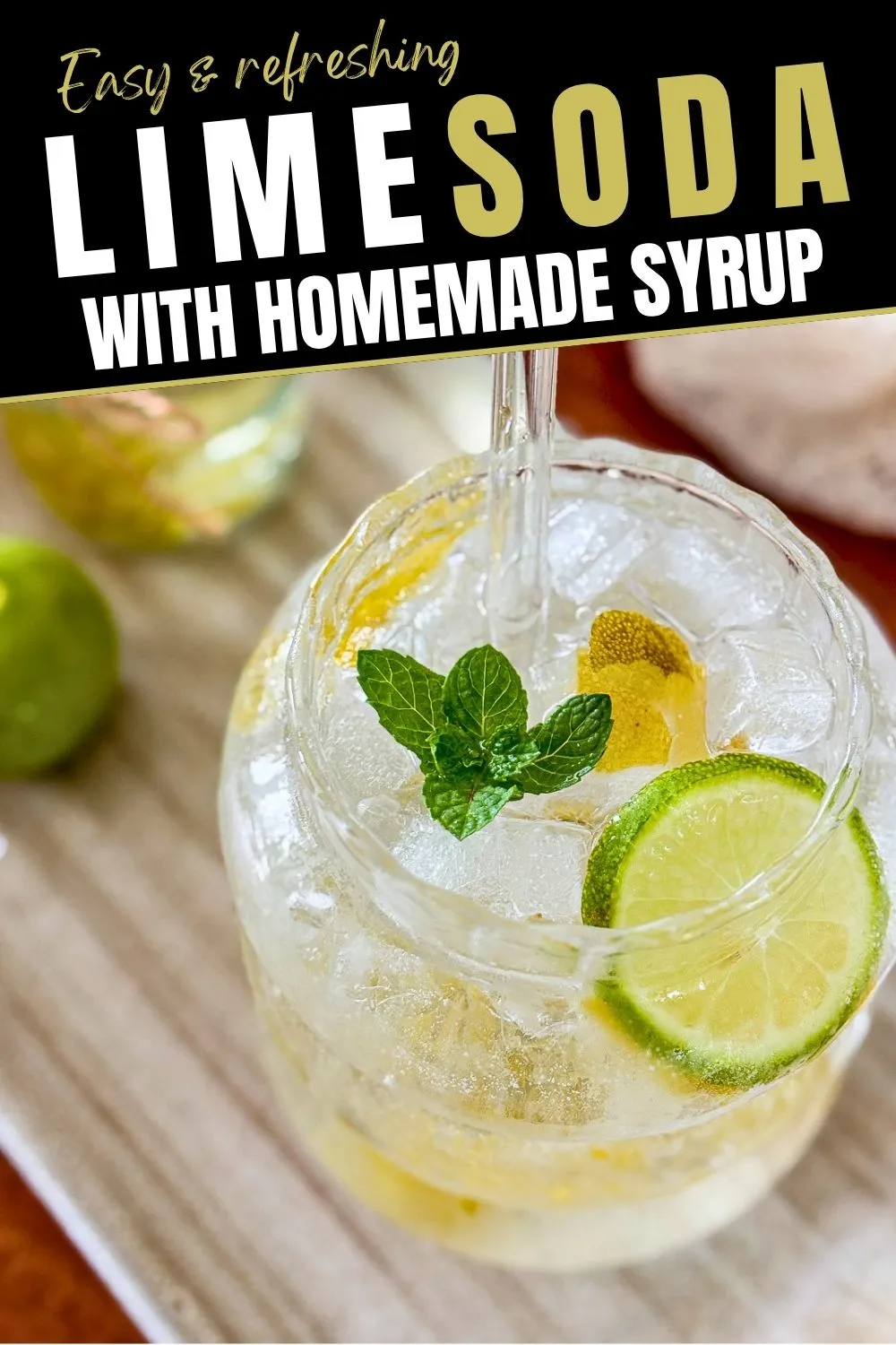 Lime soda with homemade lime syrup, fresh lime, mint, and ice.