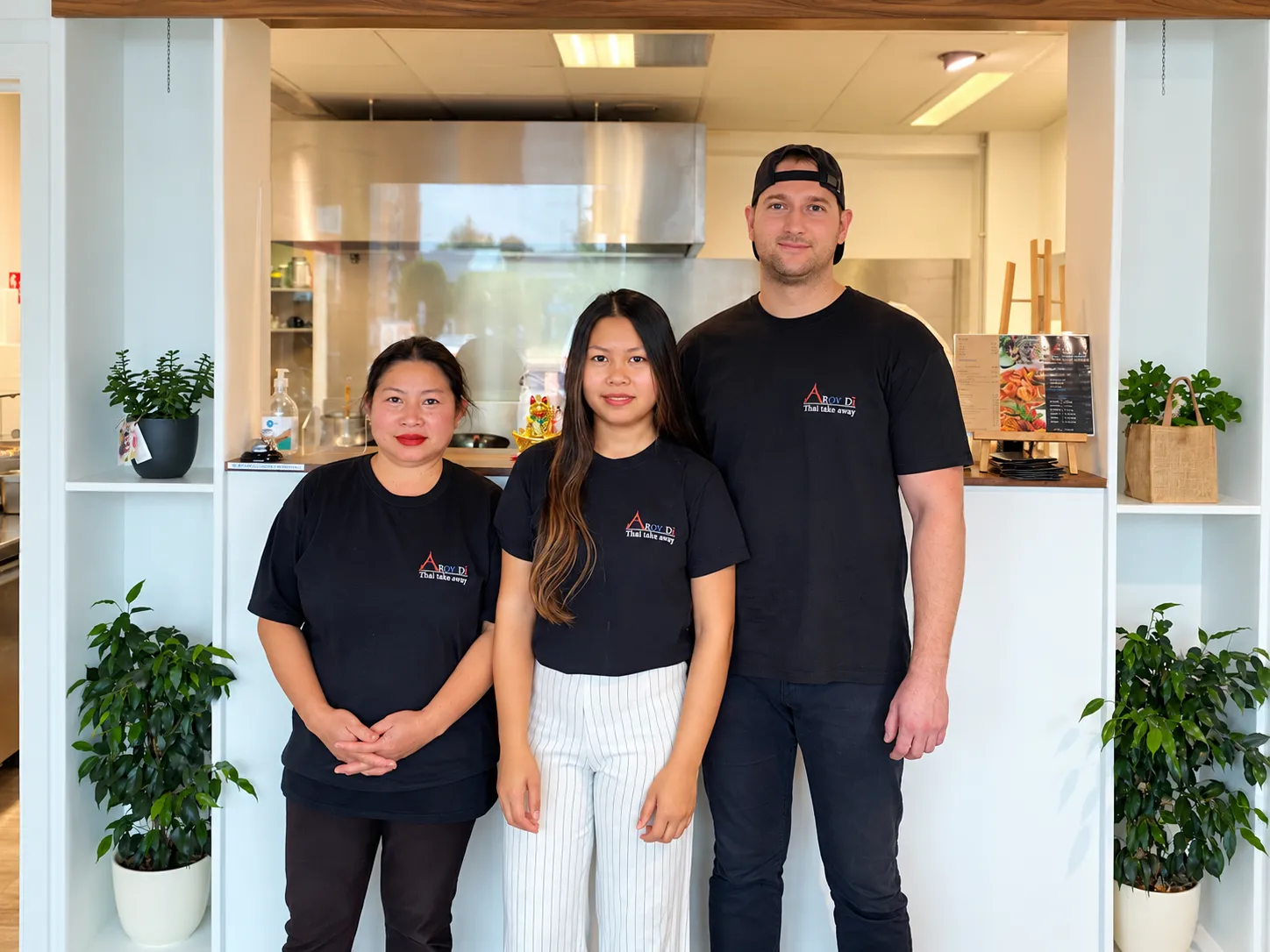 Praew with her family at their Thai restaurant in Belgium